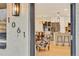 View from entryway into a bright, updated kitchen with stainless steel appliances at 1061 Elbert St, Denver, CO 80221