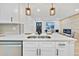 Modern kitchen sink with white quartz countertops and a black faucet at 1061 Elbert St, Denver, CO 80221