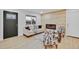 Living room with wood-paneled accent wall and modern fireplace at 1061 Elbert St, Denver, CO 80221