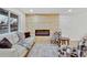 Living room with wood-paneled accent wall and modern fireplace at 1061 Elbert St, Denver, CO 80221