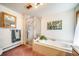 Bright bathroom featuring a tub, walk-in shower, and decorative wall art at 7815 Armadillo Trl, Evergreen, CO 80439