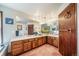 Spacious bathroom with double sinks, ample counter space, and decorative lighting at 7815 Armadillo Trl, Evergreen, CO 80439