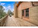 Large wooden deck with views of the mountains at 7815 Armadillo Trl, Evergreen, CO 80439