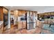 Large kitchen features custom wood cabinets, stainless appliances, and tile flooring at 7815 Armadillo Trl, Evergreen, CO 80439