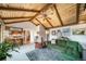 Comfortable living room featuring vaulted wood ceilings and a large green sectional sofa at 7815 Armadillo Trl, Evergreen, CO 80439