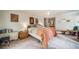 Inviting bedroom with soft carpet, decor, and windows offering ample natural light at 7815 Armadillo Trl, Evergreen, CO 80439