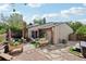 Large back patio with a barbecue area, hot tub, and ample space for outdoor entertaining and relaxing at 912 Oakwood Dr, Castle Rock, CO 80104
