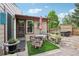 Cozy back patio with a bistro table, potted plants, and a hot tub area, ideal for intimate gatherings at 912 Oakwood Dr, Castle Rock, CO 80104