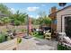 Inviting back patio with comfortable seating, brick accents, and lush greenery, perfect for entertaining at 912 Oakwood Dr, Castle Rock, CO 80104