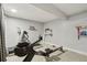 Basement gym featuring fitness equipment and shelving for weights, perfect for home workouts at 912 Oakwood Dr, Castle Rock, CO 80104