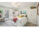 Bright bedroom with storage bed, ceiling fan, and access to outdoor patio at 912 Oakwood Dr, Castle Rock, CO 80104