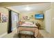 Cozy bedroom with window, soft lighting, stylish decor and a colorful painting at 912 Oakwood Dr, Castle Rock, CO 80104