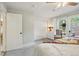 Comfortable bedroom with white walls and a view to the backyard at 912 Oakwood Dr, Castle Rock, CO 80104