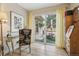 Bright living room with glass desk and view to outdoor patio with an umbrella at 912 Oakwood Dr, Castle Rock, CO 80104