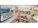 Bright living room with an open layout, comfortable seating, and a decorative floral rug at 912 Oakwood Dr, Castle Rock, CO 80104