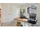 Bright office with a large window, hardwood floors, and adjacent closet and door at 912 Oakwood Dr, Castle Rock, CO 80104