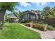 This home boasts a lovely backyard, complete with lush green lawn, raised garden beds, and charming patio at 3170 W 29Th Ave, Denver, CO 80211