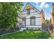 Charming two-story home with a well-manicured front yard and inviting porch at 3170 W 29Th Ave, Denver, CO 80211