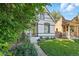 Charming home featuring lush landscaping, a well-manicured lawn, and a welcoming entryway at 3170 W 29Th Ave, Denver, CO 80211