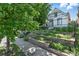 Charming home with a beautifully landscaped front yard featuring tiered planters and lush greenery at 3170 W 29Th Ave, Denver, CO 80211