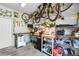 A well-organized garage features ample storage space, work benches, and racks for hanging bikes and tools at 3170 W 29Th Ave, Denver, CO 80211