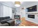 Bright living room with hardwood floors, large windows, and a modern fireplace at 3170 W 29Th Ave, Denver, CO 80211
