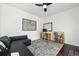 A well-lit home office features a comfortable couch, desk, and bookshelf for a productive workspace at 3170 W 29Th Ave, Denver, CO 80211