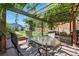 Outdoor patio featuring a pergola draped with grapevines, creating a serene space for dining and relaxation at 3170 W 29Th Ave, Denver, CO 80211