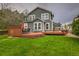 Expansive backyard with a well-maintained lawn and a multi-tiered deck, ideal for outdoor activities at 16453 Homestead Ct, Parker, CO 80134