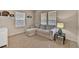 Cozy bedroom with a pull out couch, neutral decor, carpet flooring, and natural lighting at 16453 Homestead Ct, Parker, CO 80134