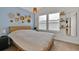 Stylish bedroom featuring warm natural light, unique wall decorations and minimalist furniture at 16453 Homestead Ct, Parker, CO 80134
