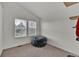 Neutral bedroom with vaulted ceiling, two windows and a comfortable lounge area at 16453 Homestead Ct, Parker, CO 80134