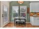 Charming breakfast nook with views of the backyard, adjacent to the kitchen area at 16453 Homestead Ct, Parker, CO 80134