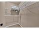 Walk-in closet with multiple shelves and carpeted flooring, ideal for organization at 16453 Homestead Ct, Parker, CO 80134