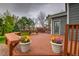 Wooden deck with outdoor seating and flower pots, perfect for relaxing in the backyard at 16453 Homestead Ct, Parker, CO 80134