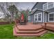 Multi-tiered wooden deck with outdoor seating, great for entertaining in this outdoor space at 16453 Homestead Ct, Parker, CO 80134