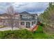 Charming two-story home boasting a cozy porch, complemented by lush green grass and tasteful landscaping at 16453 Homestead Ct, Parker, CO 80134