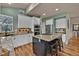 Spacious kitchen with a center island, granite countertops, and modern stainless steel appliances at 16453 Homestead Ct, Parker, CO 80134