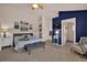 Spacious bedroom with en-suite bathroom featuring carpet floors, stylish decor, and high ceilings at 16453 Homestead Ct, Parker, CO 80134