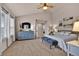 Cozy primary bedroom with lots of natural light, stylish furnishings, and ensuite bathroom access at 16453 Homestead Ct, Parker, CO 80134