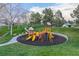 Community playground with colorful climbing structures and slides, surrounded by green space at 16453 Homestead Ct, Parker, CO 80134