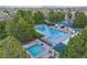 Aerial view of the community pool area, featuring multiple pools and a surrounding fence at 16453 Homestead Ct, Parker, CO 80134