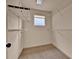 Organized walk-in closet with ample shelving and storage solutions for clothes and accessories at 16453 Homestead Ct, Parker, CO 80134