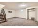 Finished basement with carpet, closet, and stairs at 492 Vance St, Lakewood, CO 80226