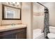 Bathroom vanity and tile shower at 492 Vance St, Lakewood, CO 80226