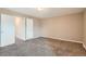 This is an empty bedroom with neutral walls and carpet, and white trim at 492 Vance St, Lakewood, CO 80226