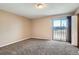 Carpeted bedroom with slider to balcony at 492 Vance St, Lakewood, CO 80226