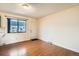 Hardwood floors define this dining space, complemented by a large window and neutral walls at 492 Vance St, Lakewood, CO 80226