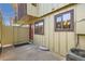 Charming exterior view of a townhome featuring a red door, windows, and a small balcony at 492 Vance St, Lakewood, CO 80226