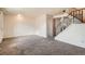 Bright, carpeted living room with staircase and neutral walls, offering a blank canvas at 492 Vance St, Lakewood, CO 80226